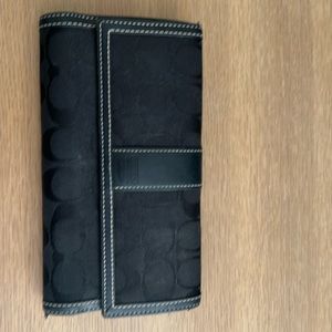 Coach Monogramed Black Trifold Wallet with snap closure and zippered coin purse
